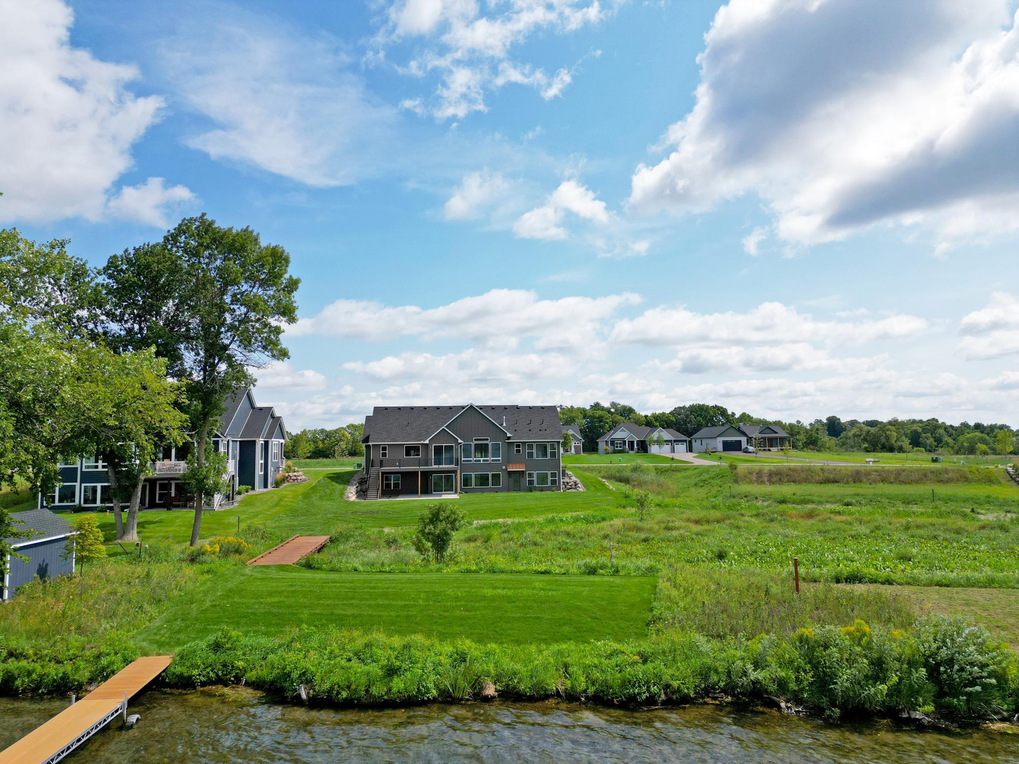 Enjoy a level backyard that gently leads to the water's edge, complete with a private dock ready for endless days on the lake.
