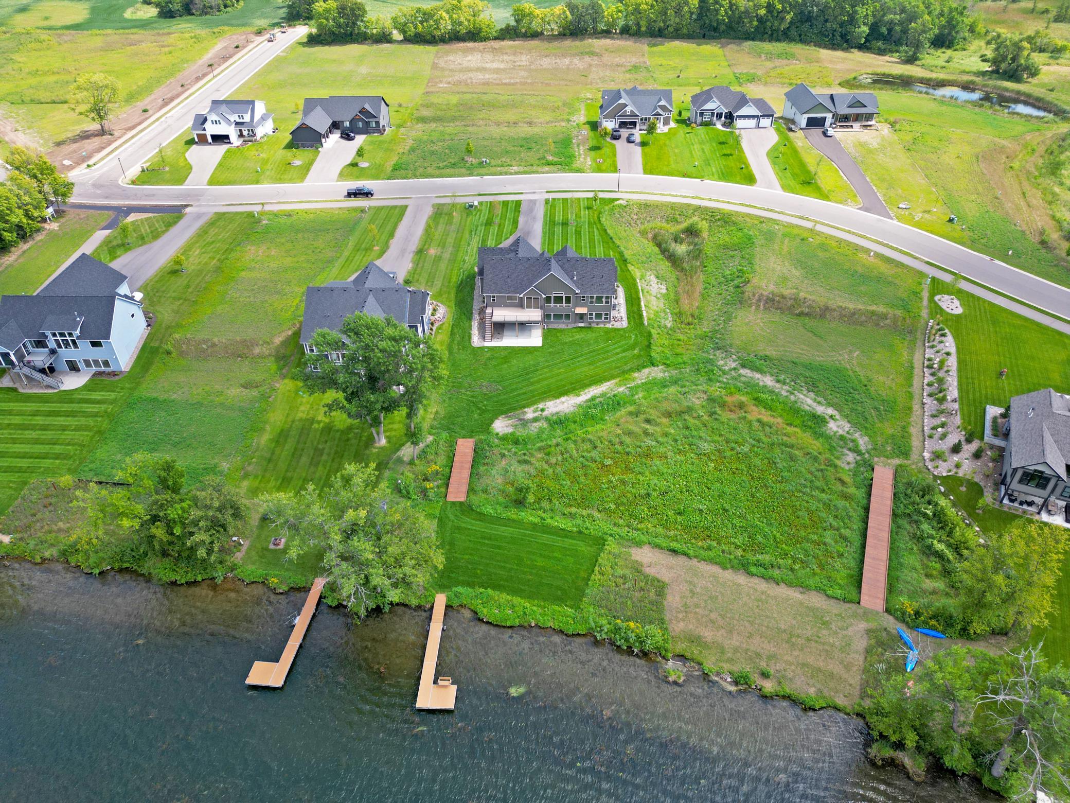 Newly completed and perfectly positioned on the water, this stunning lakeside home offers gorgeous views, and an unbeatable setting in one of the area's premier new neighborhoods.