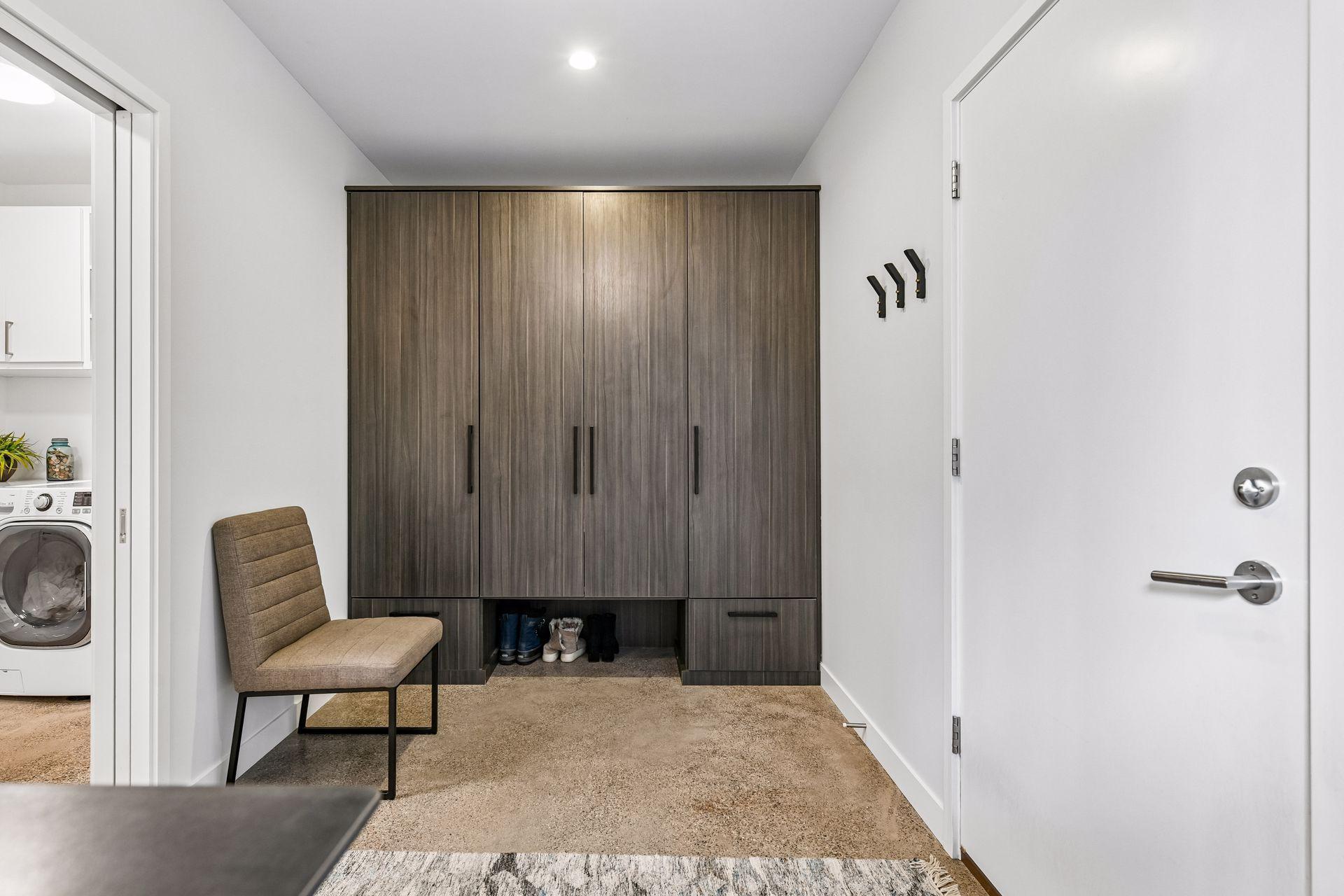 Mudroom with custom lockers with adjustable shelves