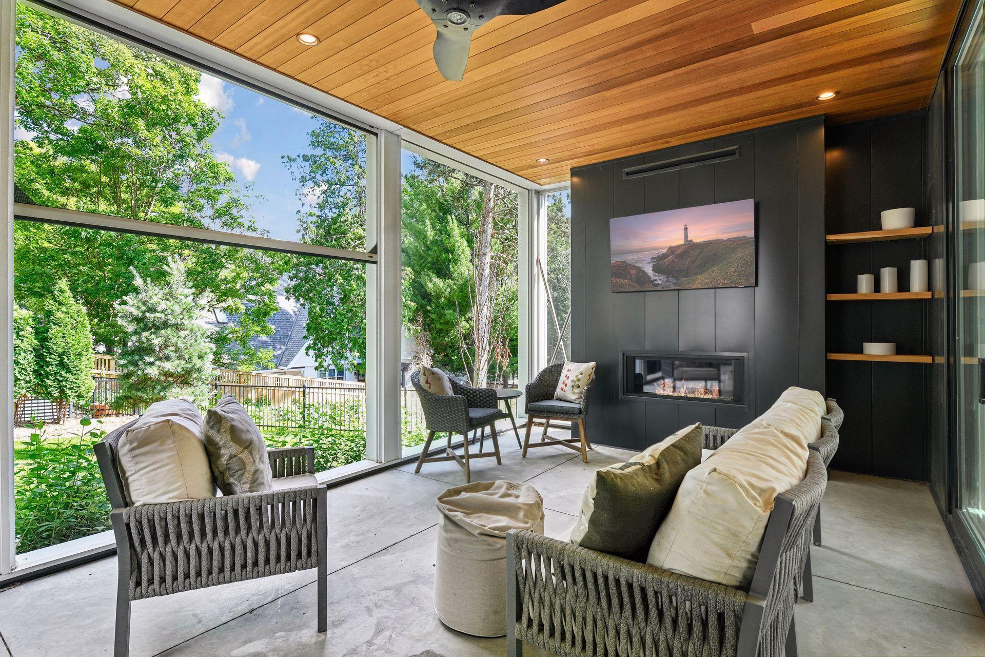 Phantom screens, fireplace and TV on porch let you enjoy the many seasons of MN