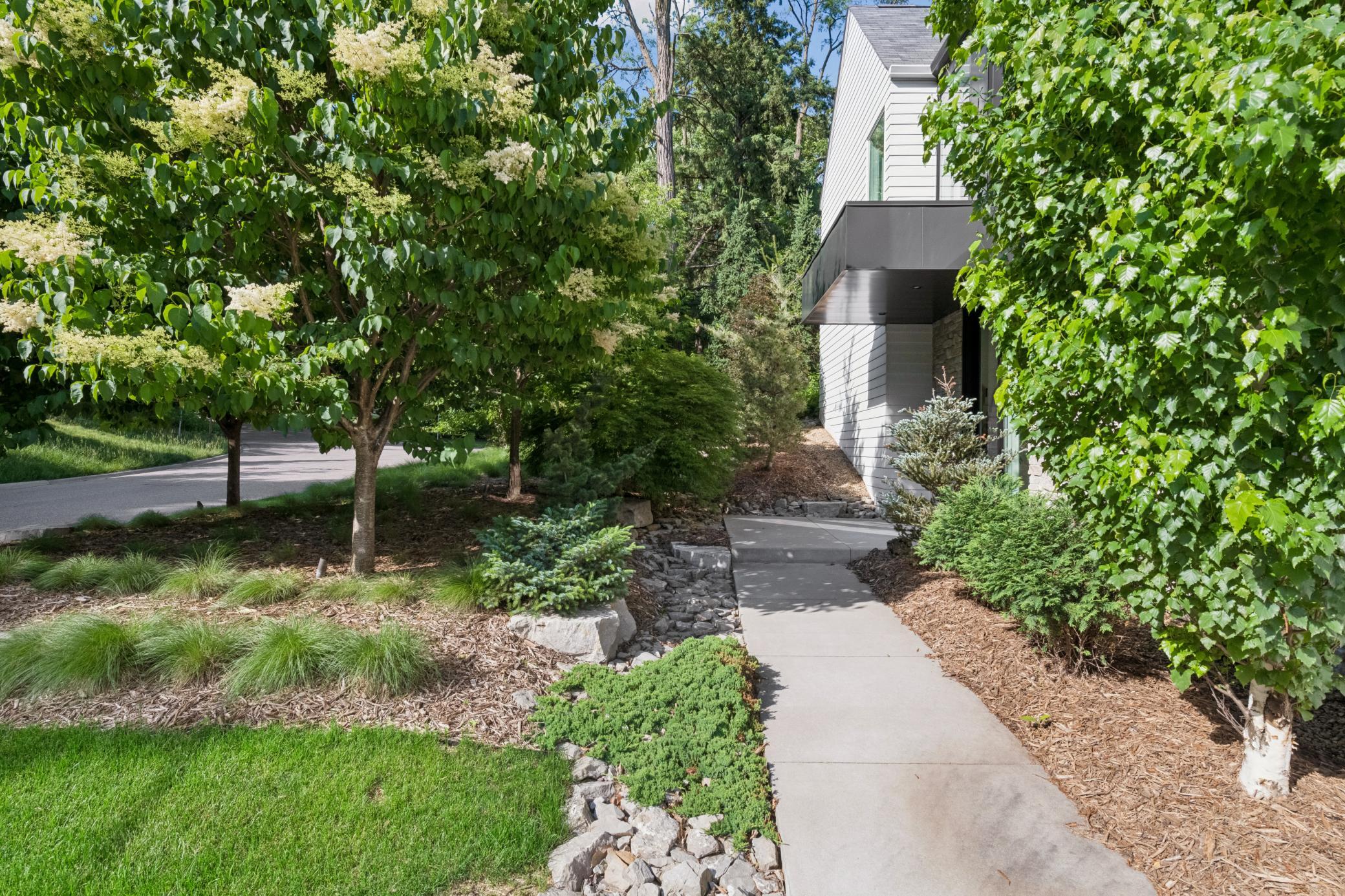 Beautifully landscaped yard welcomes you