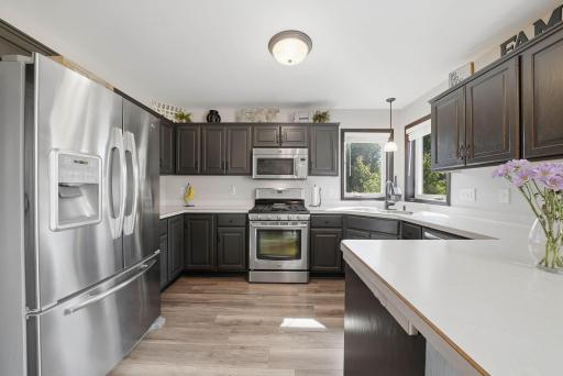 Main level kitchen features plenty of countertop space for meal prep.