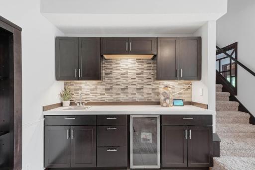 Family features wet bar perfect for entertaining guests and/or prepping for family movie night.
