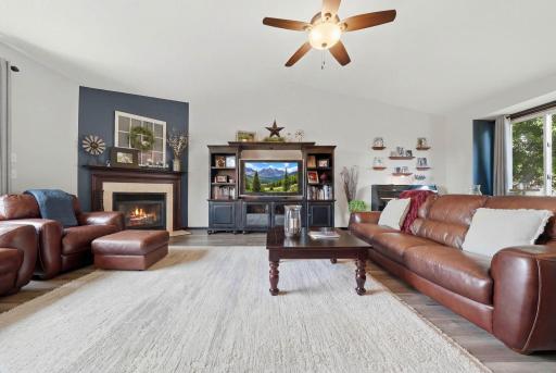 Welcome home to this spacious and beautifully maintained modified two-story residence nestled in a quiet, established neighborhood within walking distance of Rogers Schools.