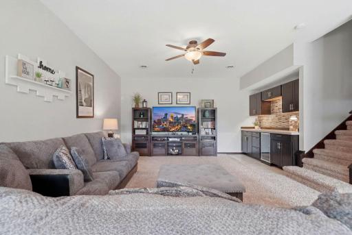 Let's head downstairs w/ 9+ foot ceilings! Spacious lower level family room features elevated ceilings & ceiling fan.