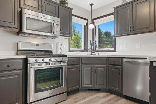 Kitchen features stainless steel appliances.