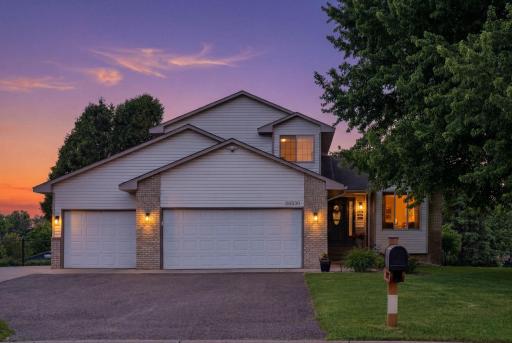 Welcome home to this spacious and beautifully maintained modified two-story residence nestled in a quiet, established neighborhood within walking distance of Rogers Schools.
