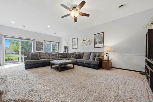 Tons of space in the family room. Featuring 9+ foot ceilings, beautiful views of the backyard, and access to patio, fire-pit, and backyard. Let's head to the patio!