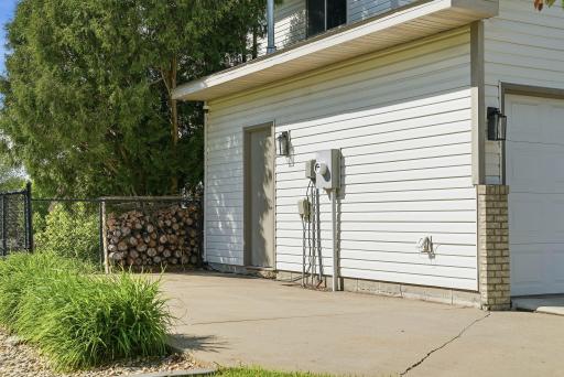 Property features additional parking pad to the south of the attached garage.