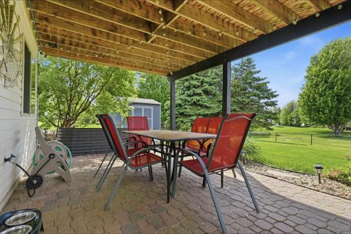 Sizable patio is right below the deck. Perfect shaded space for the warm Minnesota summers.