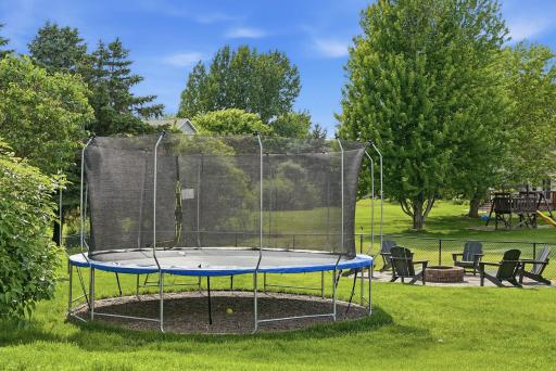 Spacious backyard has plenty of room for activities and relaxation areas.
