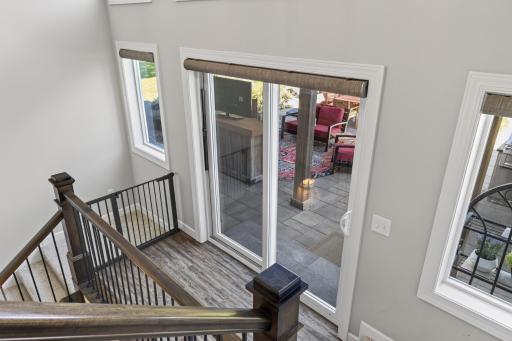 Expansive windows and patio doors bring natural light throughout the home.
