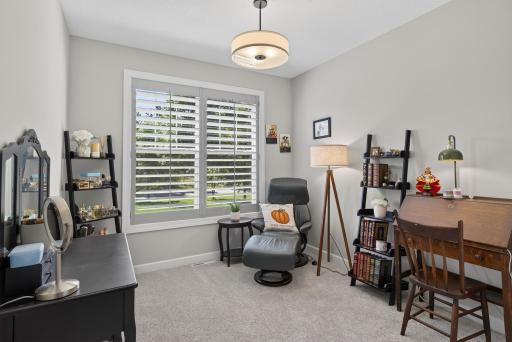Main floor bedroom with plantation shutters.
