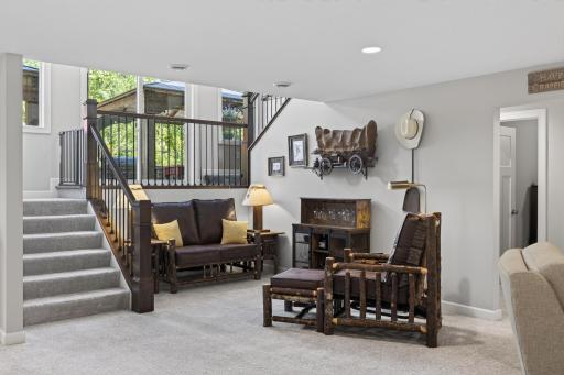 Lower-level conversation area connected to the home's entertaining spaces.