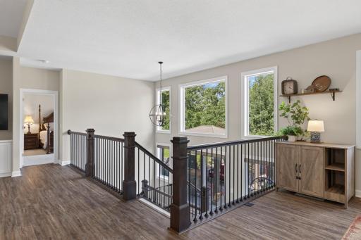 Expanded railing design creates a more open connection between the main and lower levels.