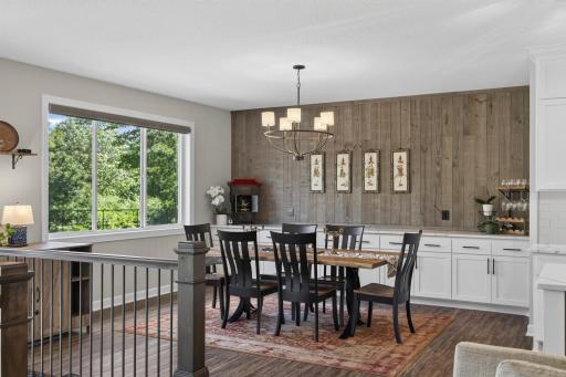 Dining space combines custom finishes with views of the surrounding landscape.