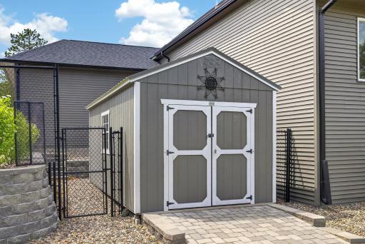 10x16 Storage shed with convenient access from the fenced backyard.