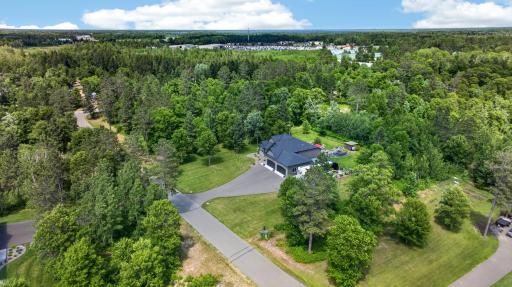 2.5-acre setting surrounded by mature trees in the heart of the Brainerd Lakes Area.