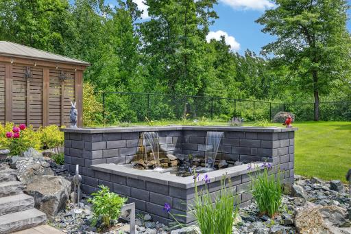 Water feature integrated into the backyard setting.