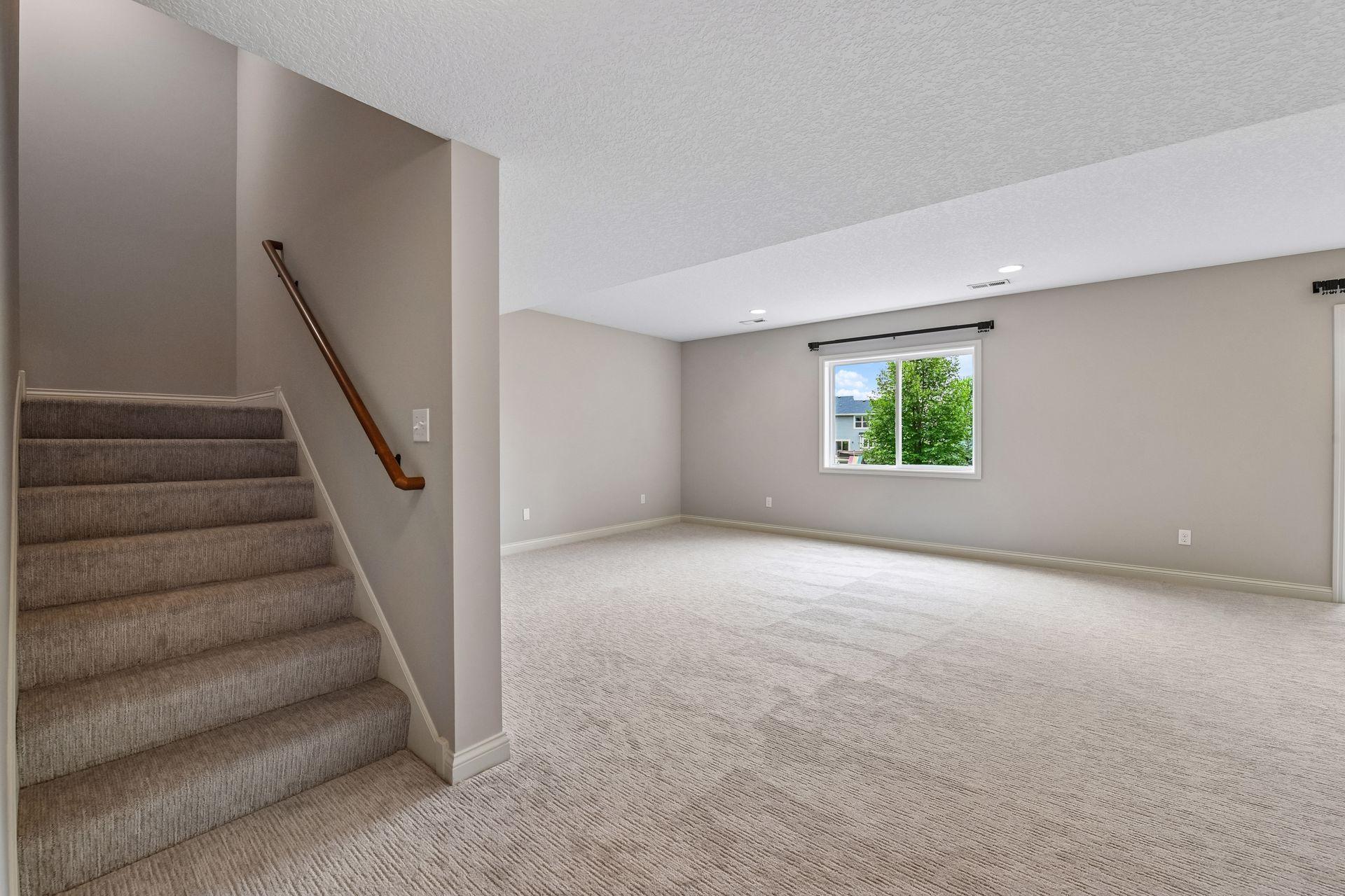 The finished lower level adds valuable living space with a family room, fifth bedroom, and three-quarter bathroom.