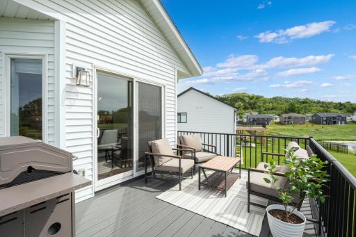Low maintenance deck with backyard access.