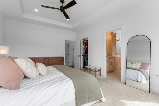 Primary suite features walk in closet and private bathroom.