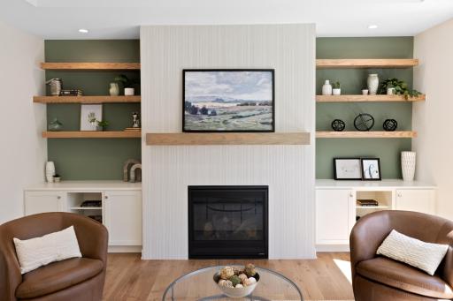 Awesome built-in storage on either side of the fireplace.