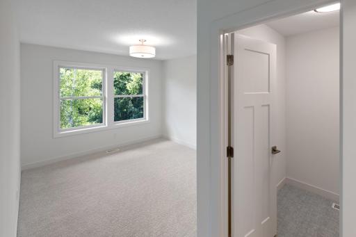 Bedroom #4 on the upper level with walk-in closet and Jack-and-Jill bathroom.