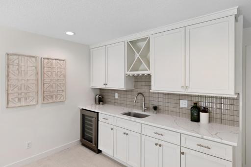 More stunning tilework and quartz countertops.