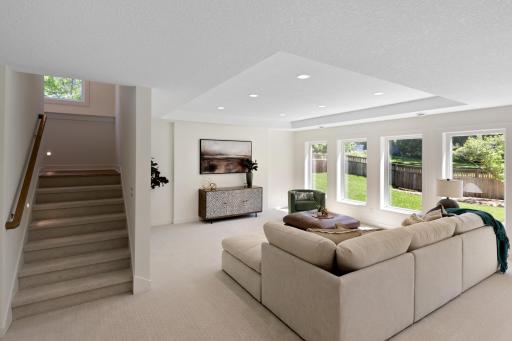 Lower level rec room is flooded with daylight from the oversized windows!