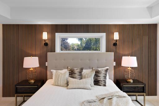 Built-in sconces on either side of the transom window.