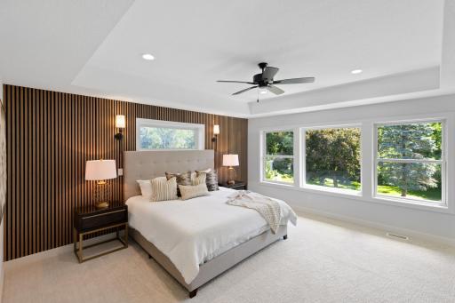 This primary bedroom is s must see: stunning accent wall, huge windows, boxed ceiling and spa-like primary bathroom. This is your oasis at the end of the day!