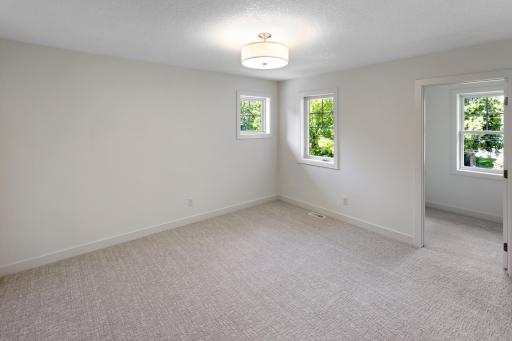 Bedroom #3 on the upper level with walk-in closet and Jack-and-Jill bathroom.