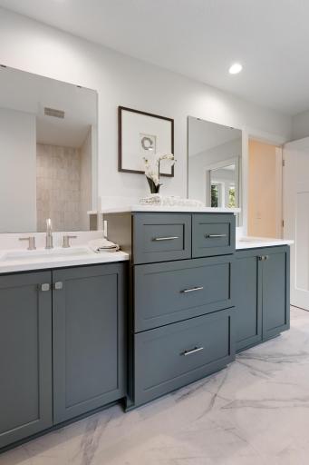 The dual vanity offers plenty of storage options.
