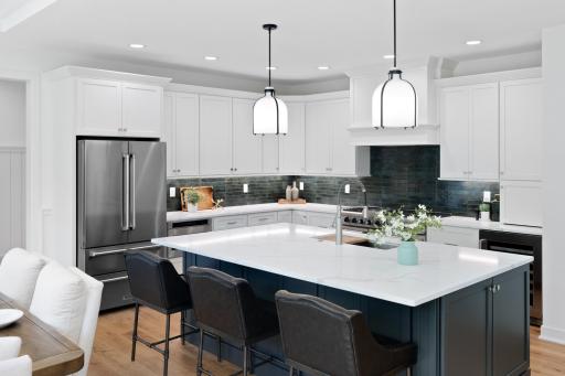 You will LOVE this kitchen! From the stylish backsplash and quartz countertops, to the abundant storage space and high end stainless steel appliances. This is a chef's dream!