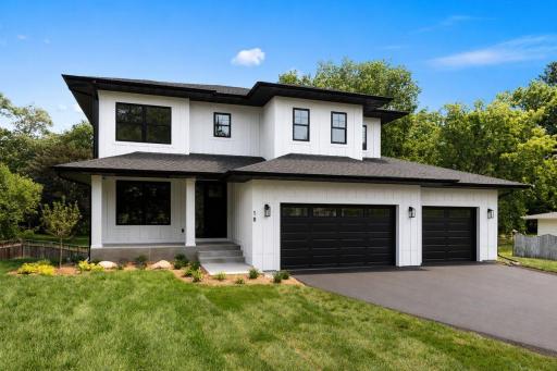 Welcome to 18 Balsam Ln N! This new home built by Boone Builders offers stylish design in an amazing location only 15 minutes to downtown Minneapolis and minutes from shops & restaurants at Ridgedale Mall. *Garage doors virtually rendered*