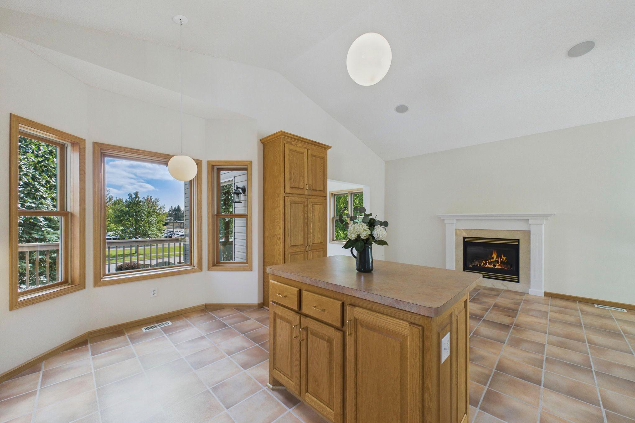 An adorable breakfast nook offers plenty of room in this eat-in kitchen