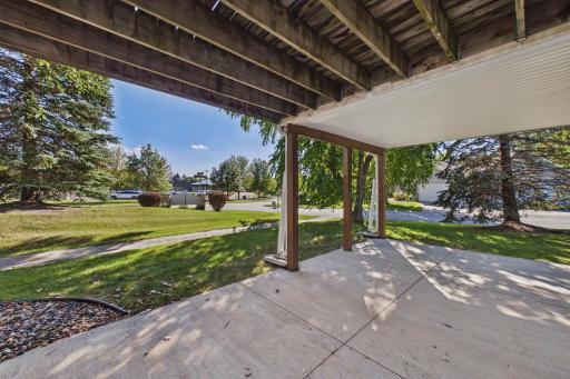 Walkout lower level opens to a covered patio and green space-an added extension of the home’s living space.