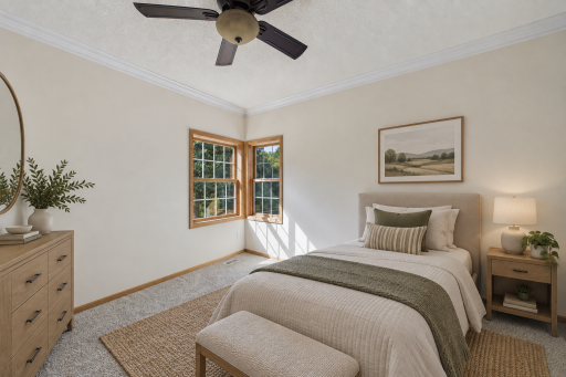 Virtually staged to showcase the bright and comfortable second main-level bedroom