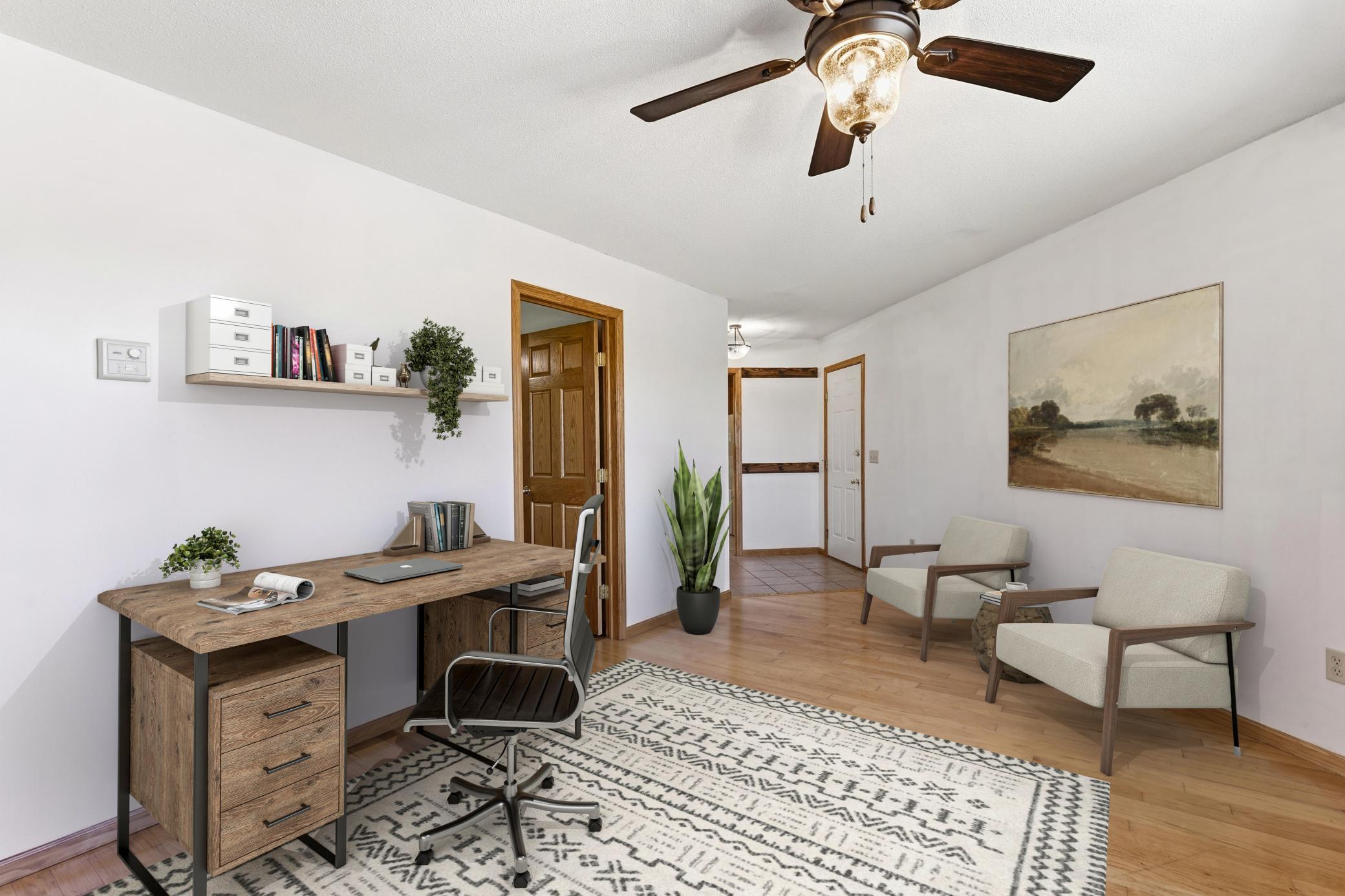 This space is virtually staged to show that this area could make a good sitting space, office, game room, dining room or overflow space for guests.