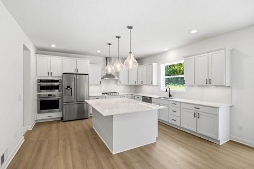 The kitchen is equally stylish and practical with sleek cabinetry, high-end finishes and all-new stainless steel appliances.