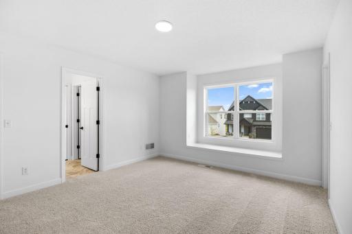 Three secondary bedrooms are situated down the hall from the ownerâs suite on the second floor.