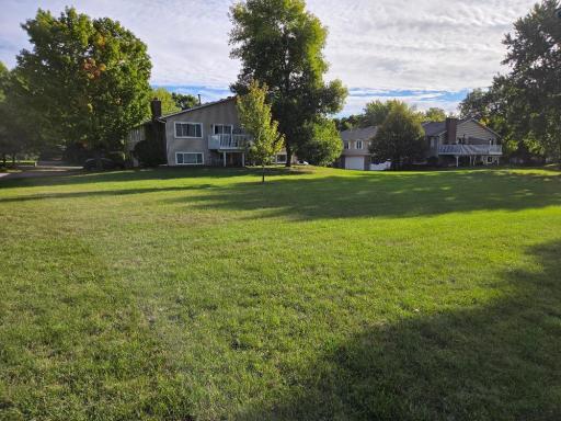 Walk to back of building to open space and play area