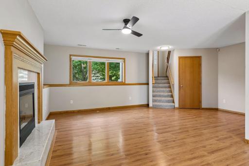 Lower level family room with newly painted ceiling.
