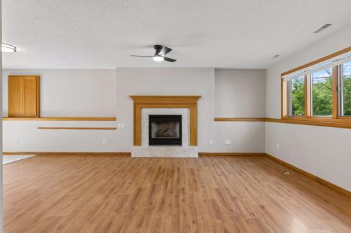 Gas fireplace with oak mantle.