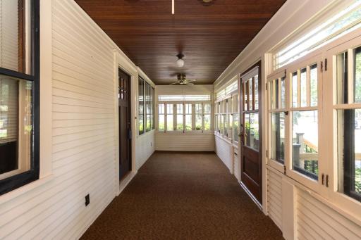 Front Three Season Porch with Rustic Charm and Wood Ceiling with Ceiling Fans