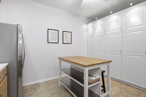 Custom Kitchen Pantry Features Extensive Storage and Convenient Sliding Drawers