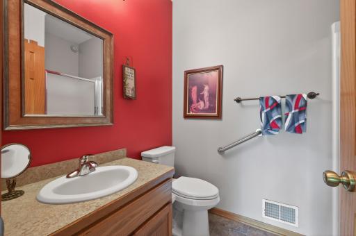 Upper level full bath located just off the main entry and across the hall from the 2nd bedroom.