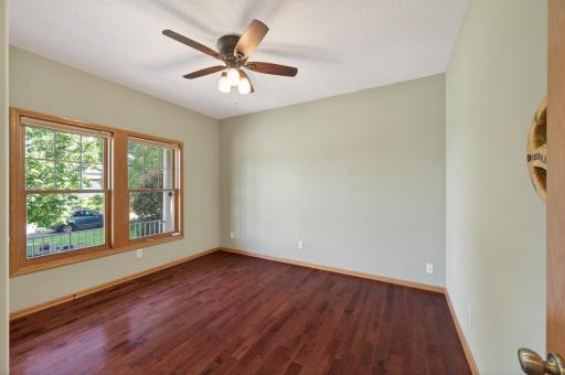 Upper level 2nd bedroom is located right off the front entrance and accross from the second floor full bath.