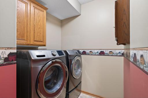 Updated washer and dryer located on the main floor just off the service entrance from the garage just a few steps from the primary bedroom.